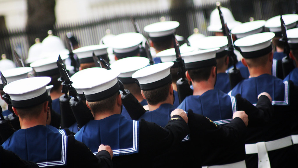 Marching image of Royal Navy Personnel.