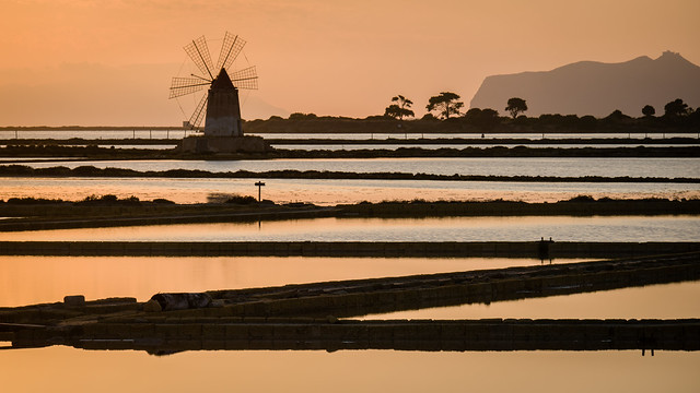 late Afternoon Light on windmill and salt pans in sicily