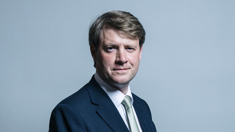 A headshot of Professor Chris Skidmore MP