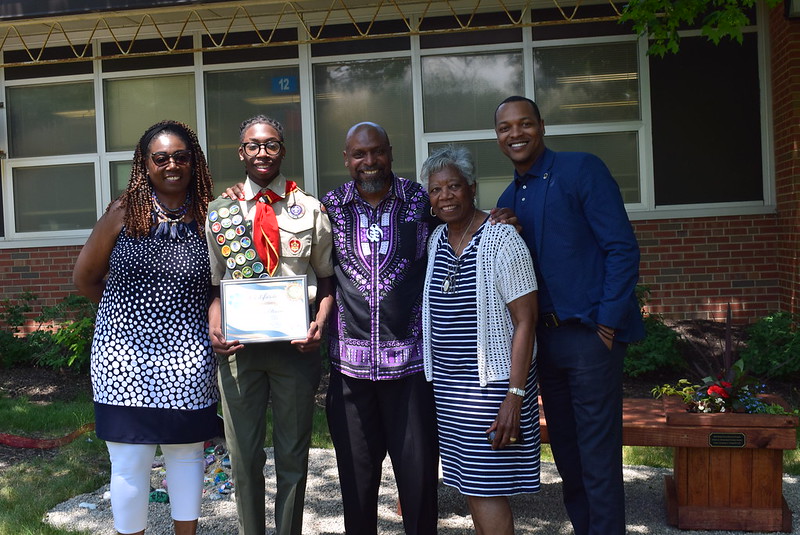 Eagle Scout Jonathan Powell with his family and Dr. Felix Anderson.