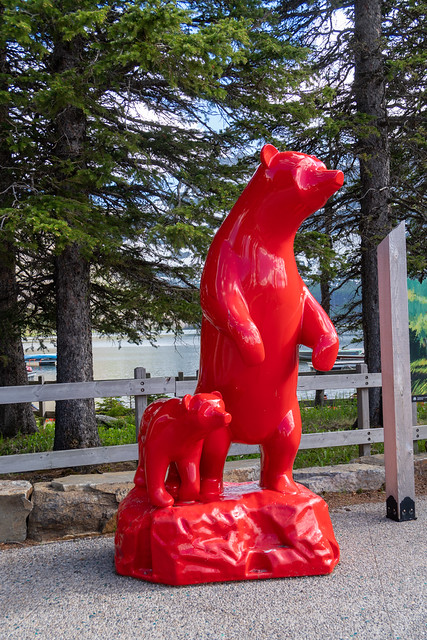 Waterton, Alberta, Canada - July 5, 2022: Red bear and cub statue at Waterton Lakes National Park