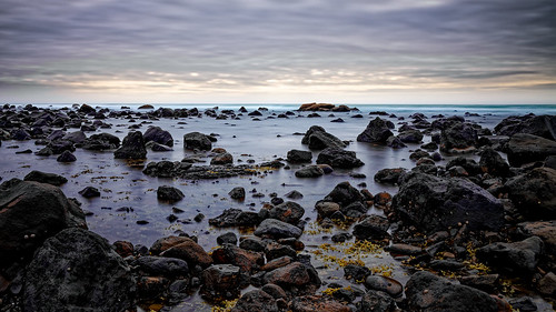 ocean newzealand clouds rocks reef efs1785mmf456isusm canoneos50d capeegmont tasmansea pungarehu nd110 ccby40 dcysurfer sunset seaweed evening windy filter shellfish whelks roaringforties neutraldensityfilter longexposure bwfprond110