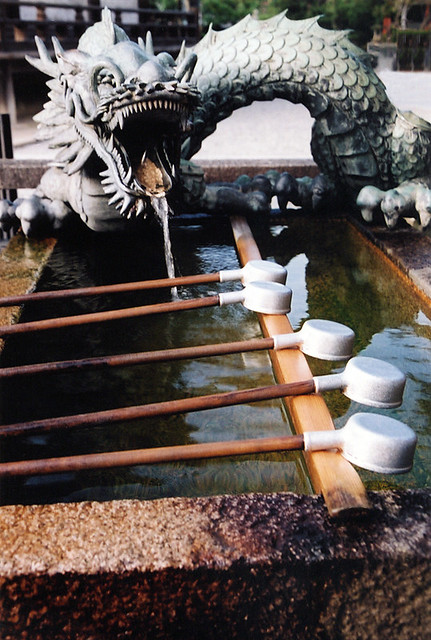 a dragon fountain guarding the holy water at Kiyomizu temple in Kyoto, Japan