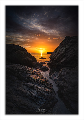 Dawn's Early Light by RTA Photography, Captured back in April light from the rising sun creates an orange glow filling the sky whilst the t