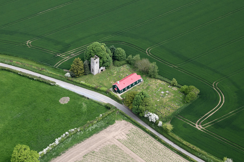 Aerial view of old & new St Mary's Church in Burgh Parva - site of a Norfolk lost village