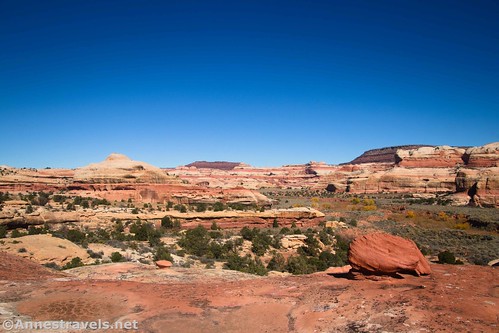 A small rock formation and views from near the spire en route to Kirk Arch, Needles District, Canyonlands National Park, Utah