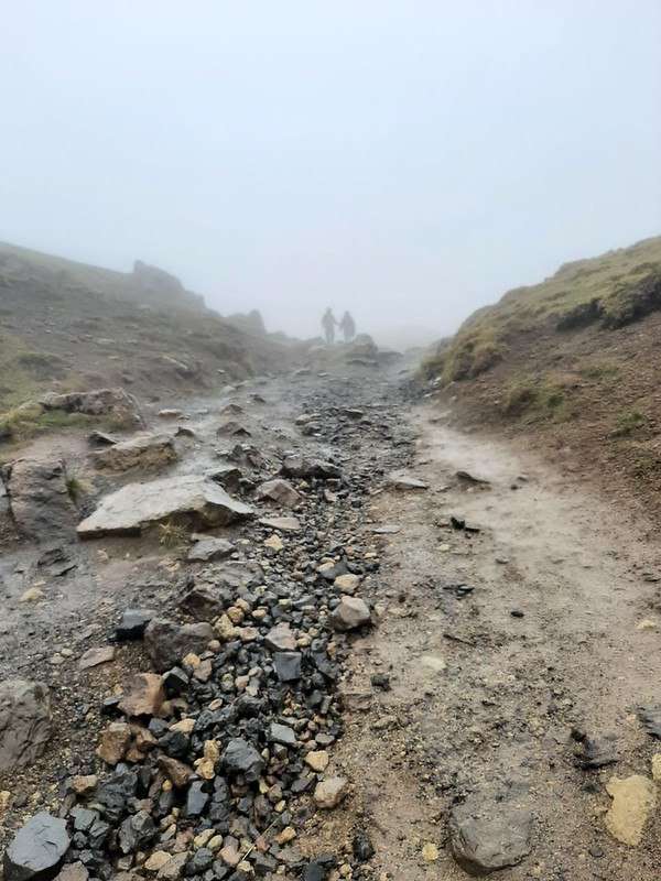 Rocky trail leading into fog