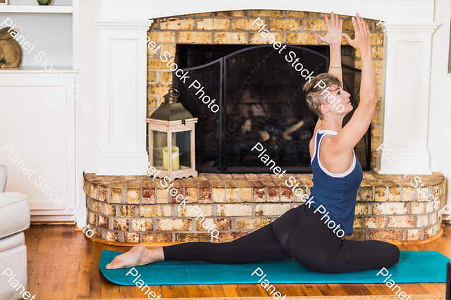 A young lady working out at home   - Stock photo with image ID: 5ee64891-ccff-42cb-9001-69141c2c13dc