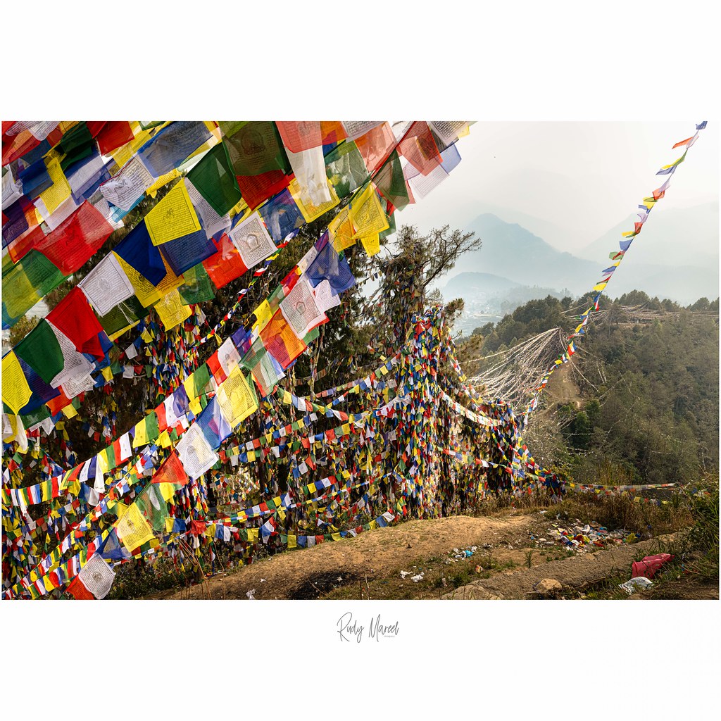 Serenity Amidst Contrasts: Prayer Flags and Trash at Namobuddha Site