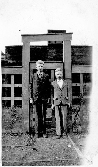 Two Brothers Stand at the Gate