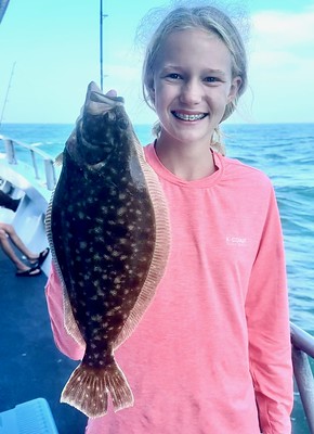 Photo of girl holding a flounder