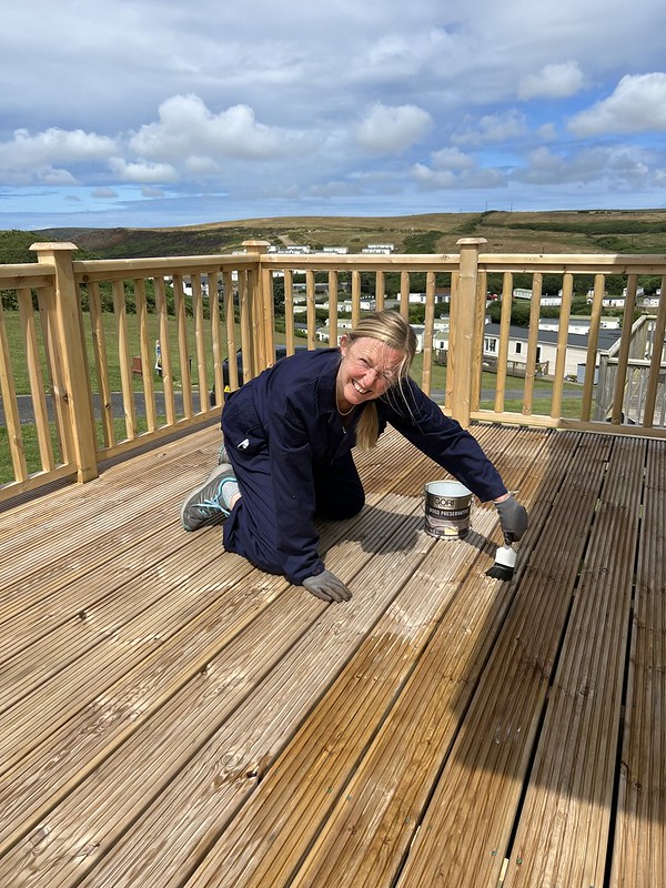 Me painting the decking