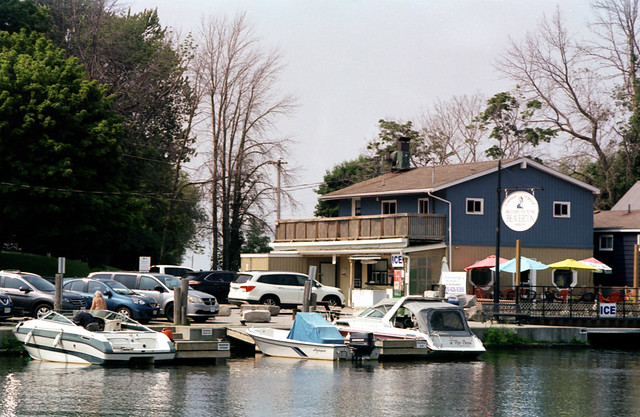Boathouses on the Beaver River Boat Mooring By Barny's June 2023