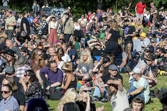 Happy people, sunshine and music in the park