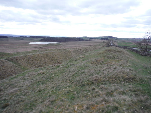 Ditch, line of Wall, Modern Military Road (left to right); near Carraw Farm SWC Walk 413 - Hadrian's Wall Path Core Section (Lanercost to Halton Chesters)
