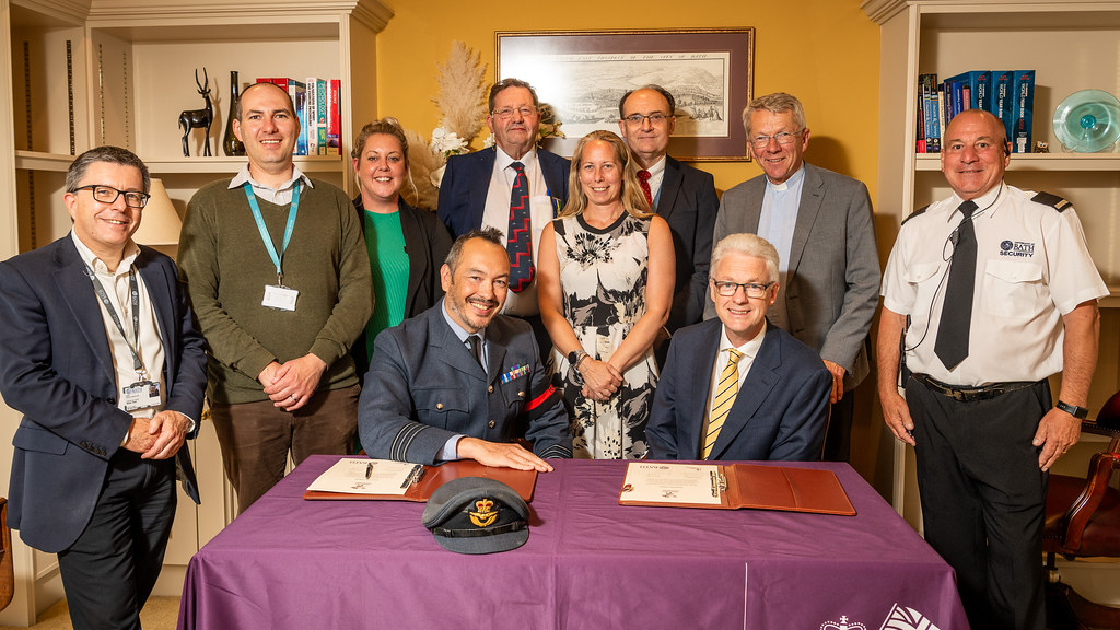 Professor Ian White and university staff with a member of the armed forces