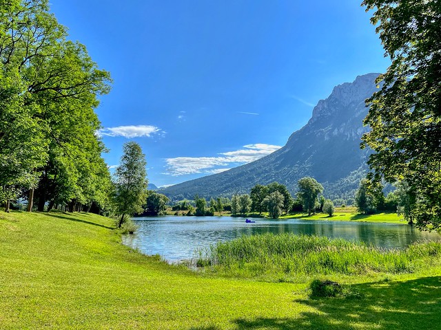 Lake Kieferer See with Zahmer Kaiser mountain range in Kiefersfelden in Bavaria, Germany