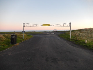 Road barrier in Bamburgh at sunrise