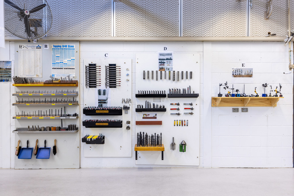 Drill bit rack | Drill bits are stored in racks on a white w ...