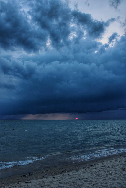 Sunset through an oncoming storm over Lake Michigan, Pierport, Michigan