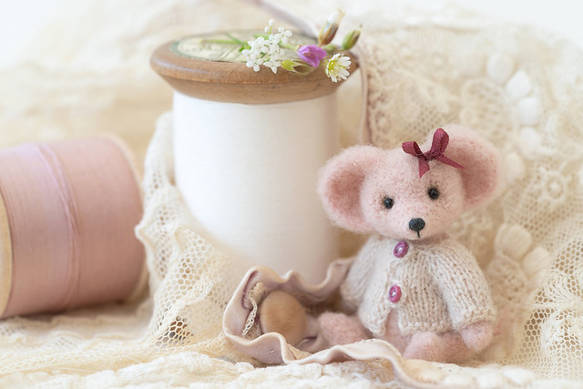 A pink mouse and antique lace