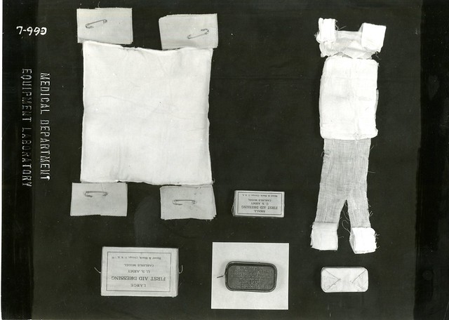 Medicine - Military - Equipment: Carlisle Model First Aid Dressings Showing Container and Contents