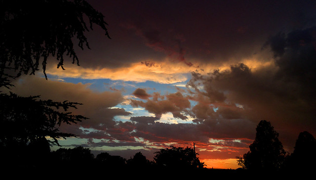 My neighborhood in Albuquerque with iPhone: stormy sunset. New Mexico, USA.
