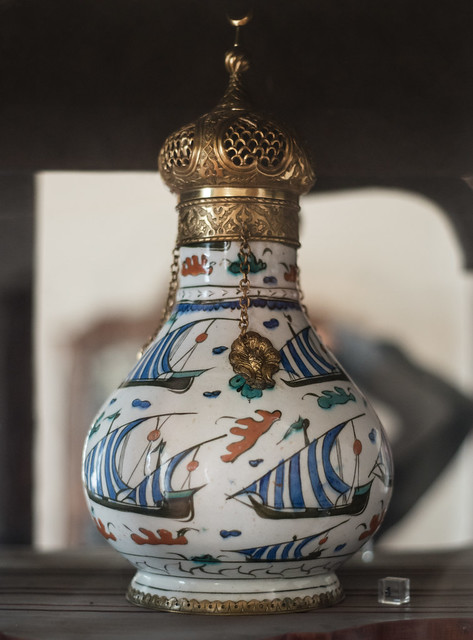 Iznik flask with decoration of galleys and brass top
