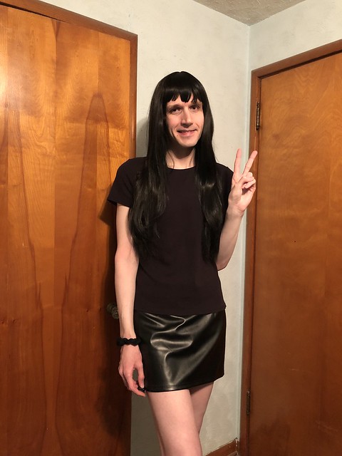 crossdresser wearing faux leather skirt