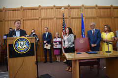 State Rep. Nicole Klarides-Ditria joined her colleagues from the Public Health Committee, for a press conference for Governor Lamont to sign HB 6669 - An Act Protecting Patients and Prohibiting Unnecessary Healthcare Costs - into law. 

This strongly bipartisan legislation requires the state Comptroller to establish a Drug Discount Card Program for all state residents, prohibits hospitals and health systems from charging certain facility fees, expands the list of medications eligible for reduced rates to the state, prohibits &quot;steering&quot; of medications or gag orders that prevent consumers from getting the best price, and restricts health systems from forcing consumers to use specific, name-brand drugs when a generic is available, and more.