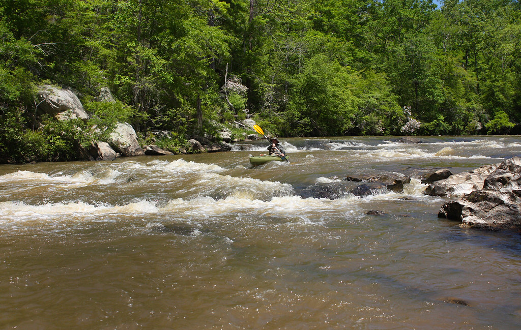 A kayaker paddles Hatchet Creek in Alabama.