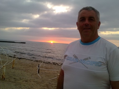 2011 - Crete Holiday 28c - John with the Sunset at Anissaras Beach