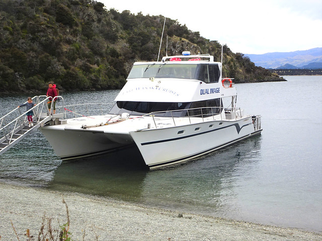 Wanaka New Zealand. Cruise boat landed on a small island in Lake Wanaka.
