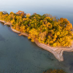 Serenity in the Thousand Islands This aerial photograph captures the essence of Grape Island in the Thousand Islands, Ontario, Canada during the autumn season. The warm orange glow of the setting sun casts a timeless and majestic atmosphere over the island&#039;s vibrant fall foliage, reflecting the serene beauty of the St. Lawrence River. The image exudes a sense of peace and tranquility, inviting viewers to experience the enchanting allure of this hidden gem in the heart of Canada&#039;s breathtaking landscape.

&lt;a href=&quot;https://Duncan.co/serenity-in-the-thousand-islands&quot; rel=&quot;noreferrer nofollow&quot;&gt;Duncan.co/serenity-in-the-thousand-islands&lt;/a&gt;