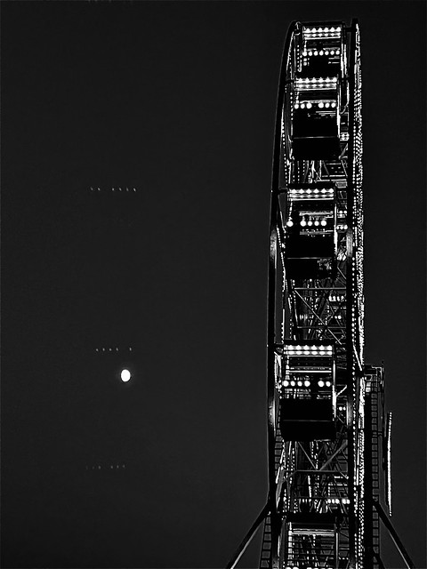Ferris wheel by moonlight in black and white