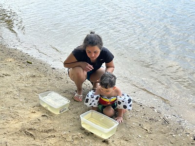 Seining on the James - a mother and son observe the species that were caught during seining