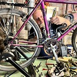 20230711-USDA-RD-RPN-WV-AS-0003 Nik Salvo, co-owner of Bigfoot Braxxie’s Bikes in Gassaway, West Virginia, works on a bicycle in his shop, on July 11, 2023. Bigfoot Braxxie’s Bikes is located adjacent to the Elk River Trail and offers bicycle and kayak rentals and is one of the many rural small businesses that will benefit from the Pioneer Trail Towns project that the Pioneer Community Network is working on with the U.S. Department of Agriculture (USDA) Rural Partners Network. The project focuses on developing needed infrastructure for the towns along the Elk River Trail and Little Kanawha River Trail, both of which run through the Pioneer Community Network. USDA Photo by West Virginia Public Affairs Specialist Andrew Stacy.