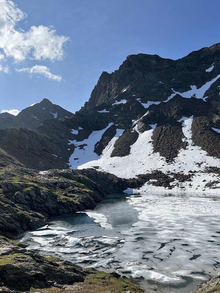 Glacier lake in front of snowy mountain