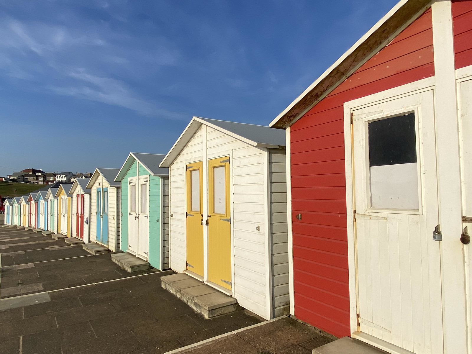 Colourful beach huts at Bude, Cornwall, England