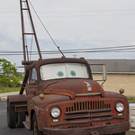 IMG_4816a When the Pixar crew first traveled down Route 66, the studio’s “story guru,” Joe Ranft, became inspired by a rusty old pickup truck he saw in a junkyard near Galena, Kan. That truck provided much of the template to the equally rusty and rickety Mater.
Galena&#039;s “Mater” is a 1951 International boom truck, not a tow truck. The extra-long boom was used to lift equipment out of the lead-mine shafts that dot the region. Wallis confirmed it is the same truck that Ranft saw in 2001.