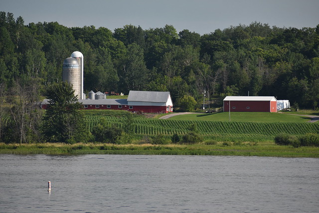 A look at a farm from across a river