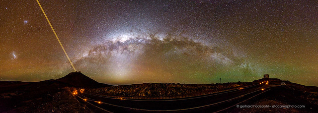 The Milky Way arching from the VLT telescopes to VISTA, with the 4 Laser Guide Star, the Magellanic clouds, Zodiacal light and green airglow