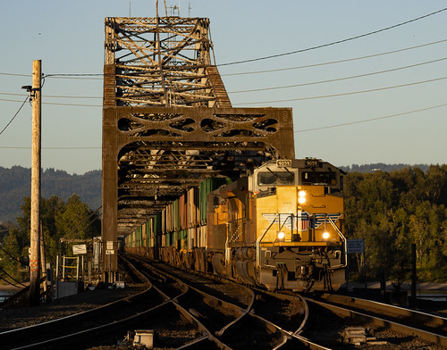 Vancouver, WA by loaded_baretable, Shortly after sunrise, a UP trash empty bound for PSAP rolls off the Columbia drawbridge. 