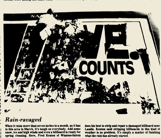 Fred Keaton of Naegele Outdoor changes out a billboard in Landis, 1993