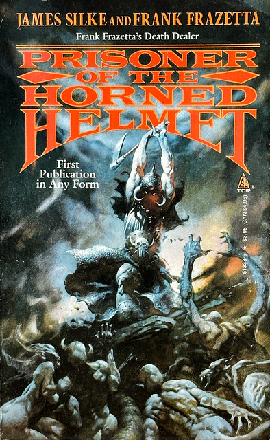 “Prisoner of the Horned Helmet” by James Silke. TOR Books (Feb., 1988). Cover art by Frank Frazetta, featuring the “Death Dealer.”