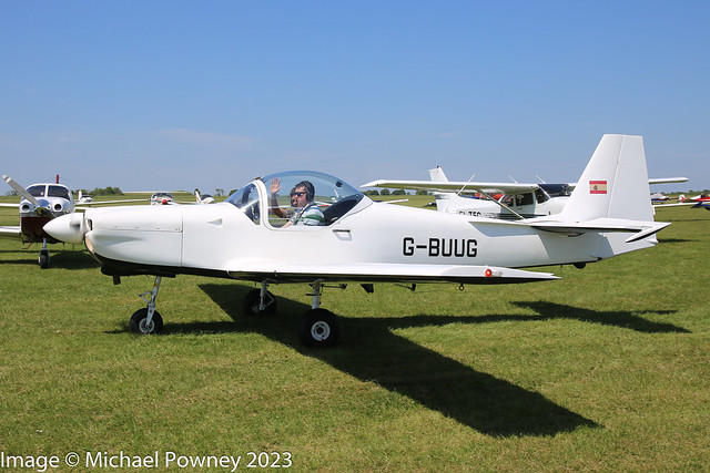 G-BUUG - 1993 build Slingsby T.67M Firefly MkII, taxiing for departure at Sywell during Aero Expo UK 2023