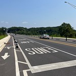 View north of bike and bus lanes on Harford Road Bridge, Baltimore, MD 21214 Photograph by Eli Pousson, 2023 July 26.