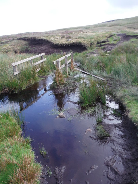 'Slightly' submerged footbridge across the upper reach of the Faraday Gill beck SWC Walk 416 - Nine Standards (Kirkby Stephen Circular or to Garsdale)