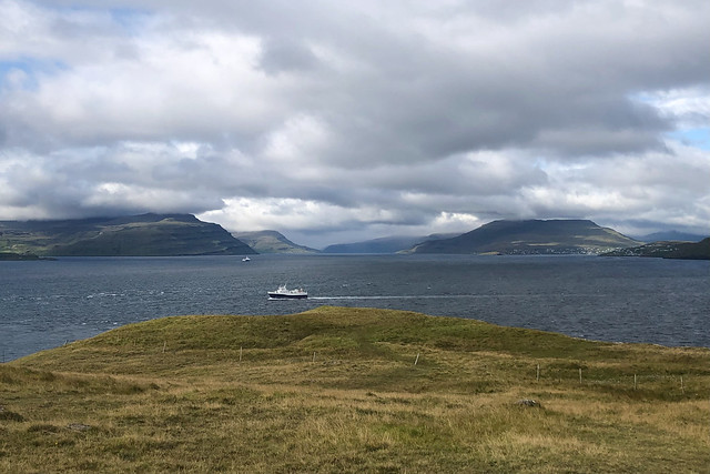 Ship in Nólsoyarfjørður, view to Streymoy and Eysturoy,  Nólsoy, Faroe Islands