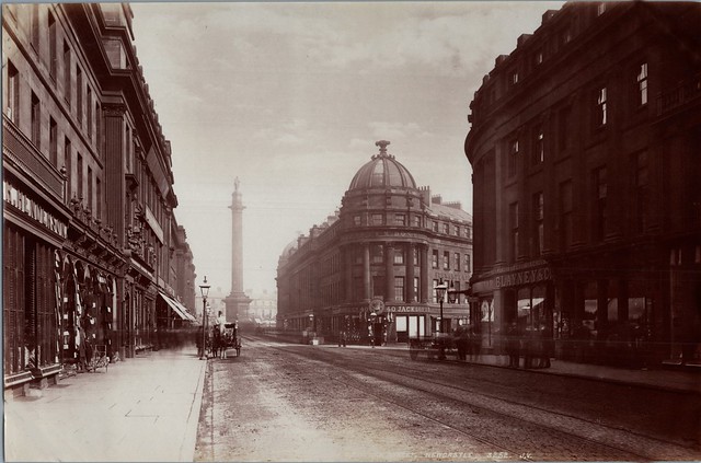 An early view of a quiet looking Grainger Street, close to the junction of Market Street, Newcastle upon Tyne with tramlines in place for the horse drawn trams. Blayney & Co over at right was a wine & spirit merchant.